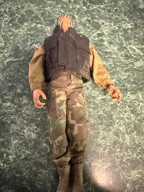 Vintage Military Action Figure with Camo Pants and Black Vest